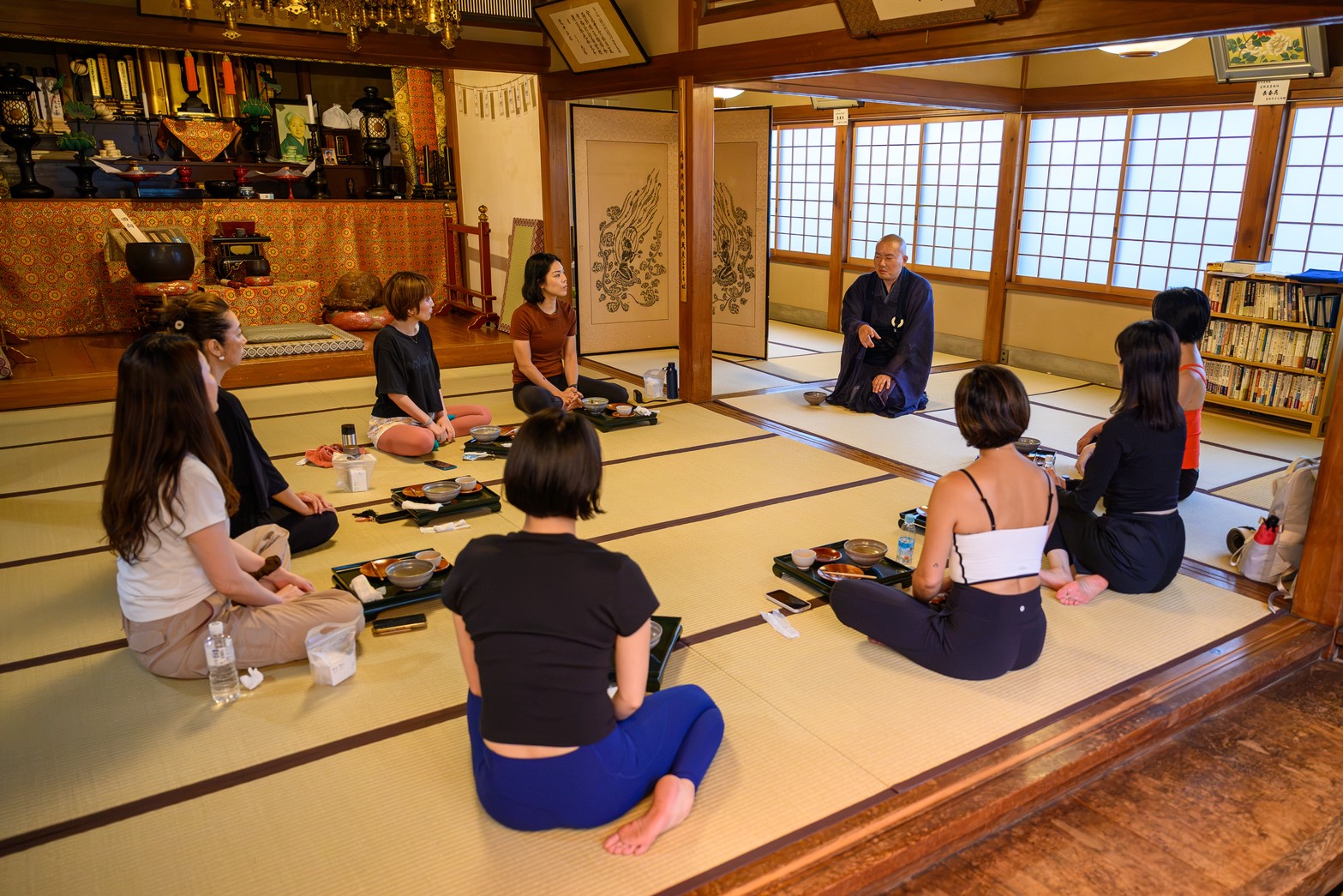 Guests and the head priest together inside Kinryuji Temple