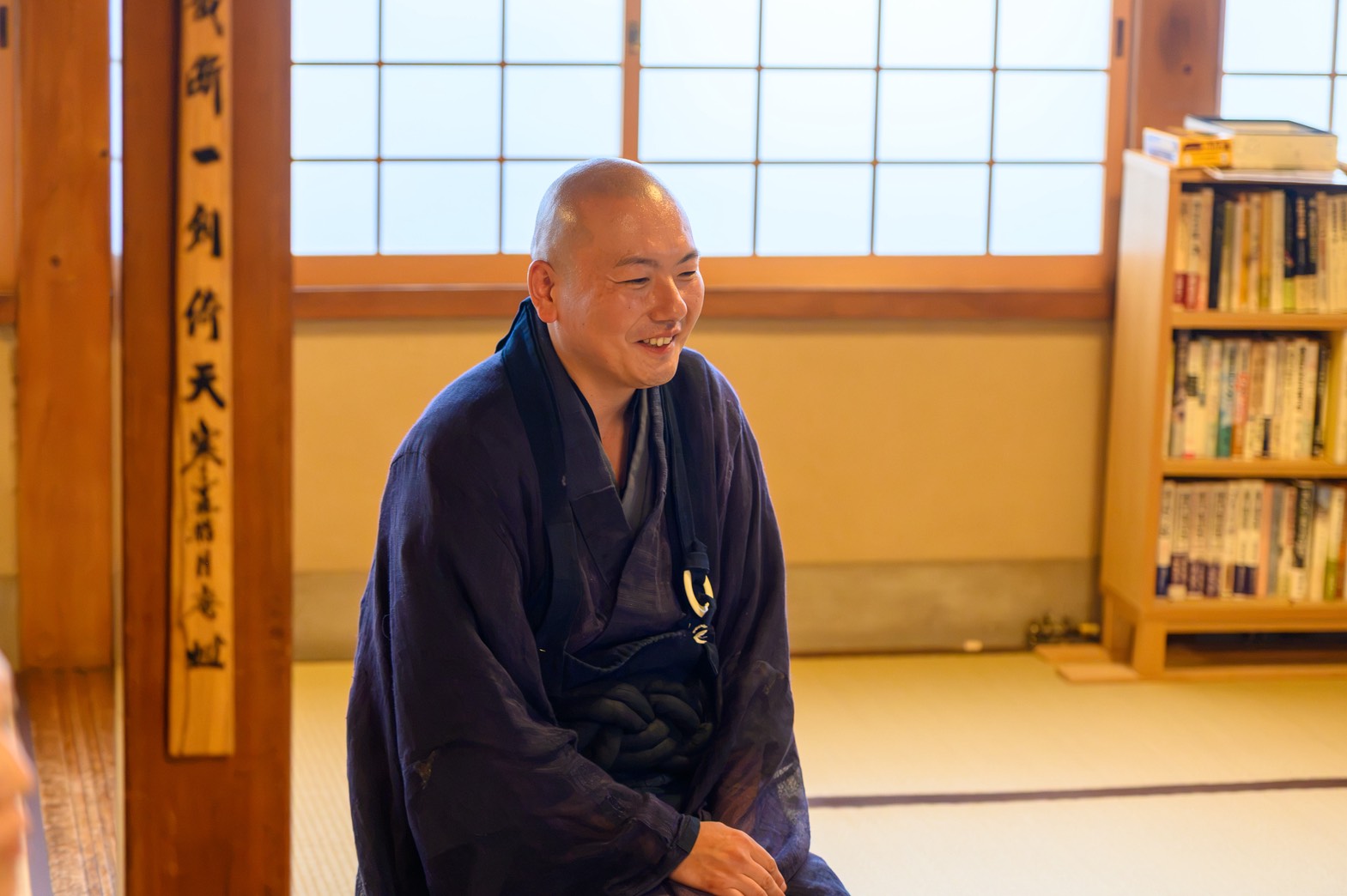 The head priest of Kinryuji Temple smiling during the tea conversation